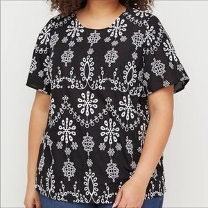 Black blouse with white floral embroidery